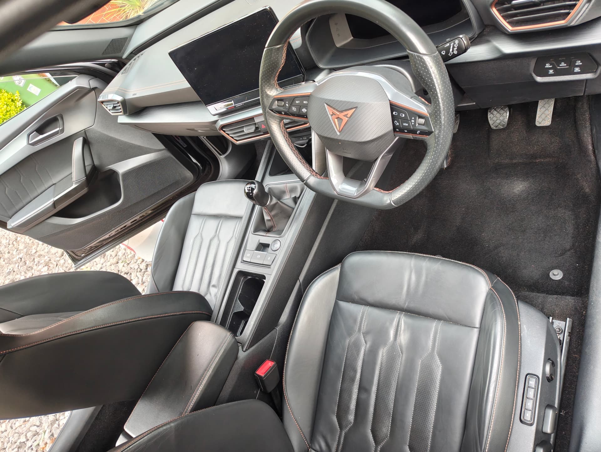 Cupra cabin with clean carpets, seats and console after detailing