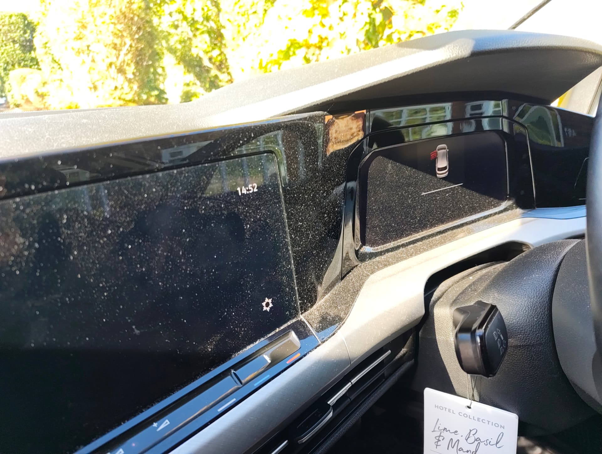 Golf dashboard and infotainment screen covered in dust before interior detail