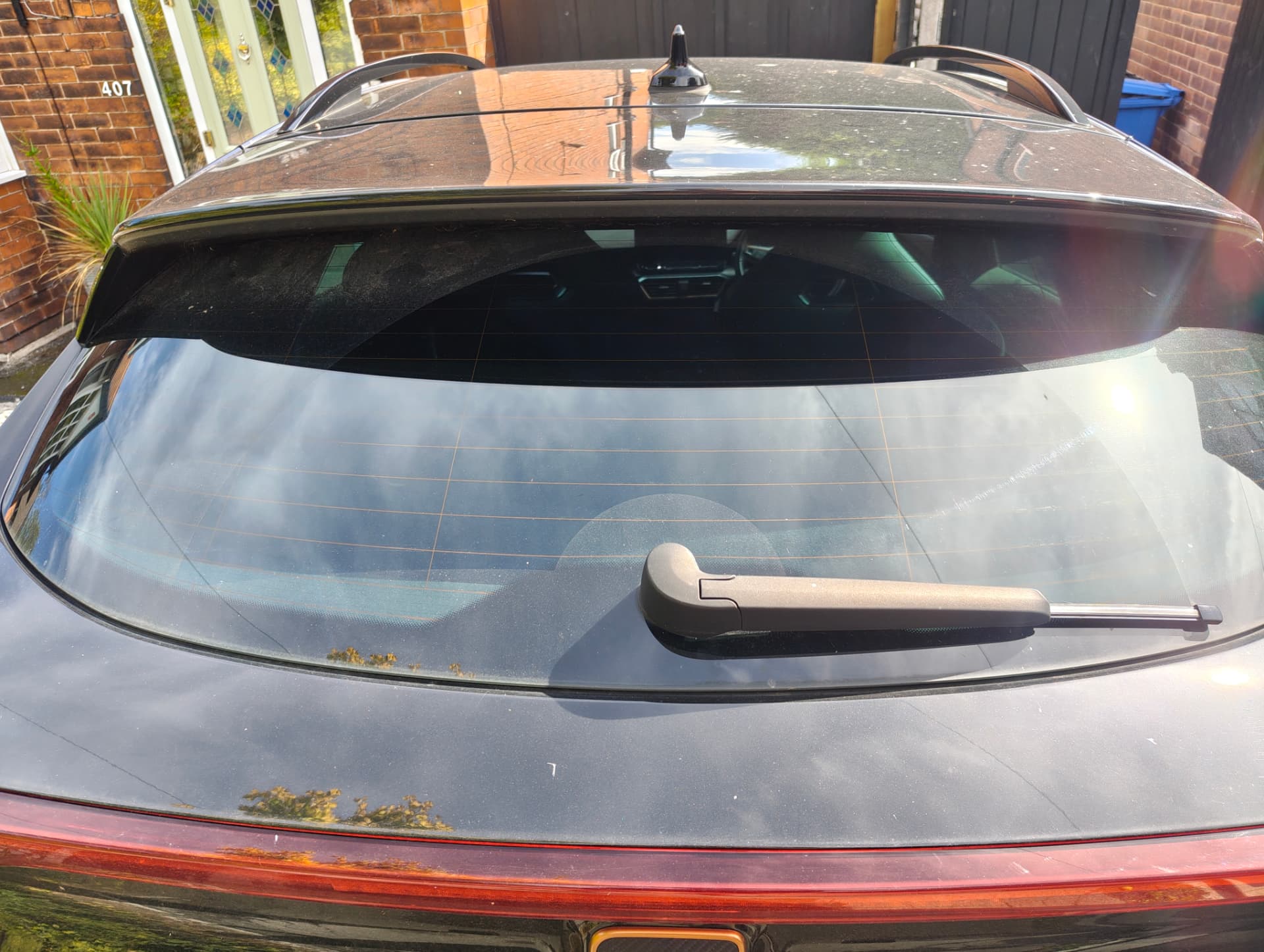Cupra rear window and hatch with dirt before wash