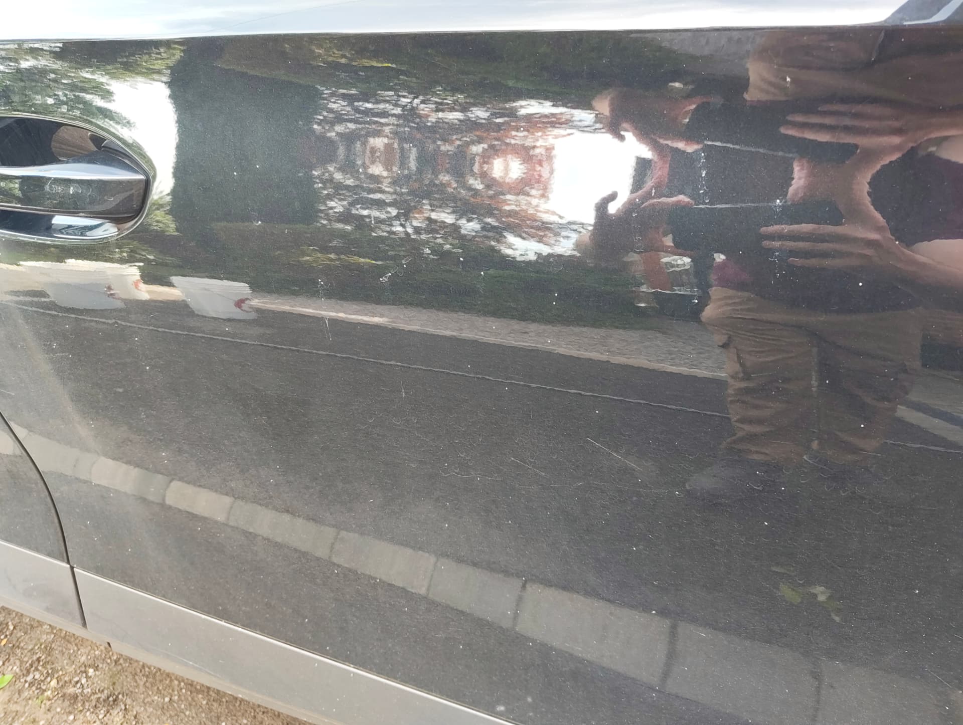 Cupra side panel with swirl marks and dirt before correction