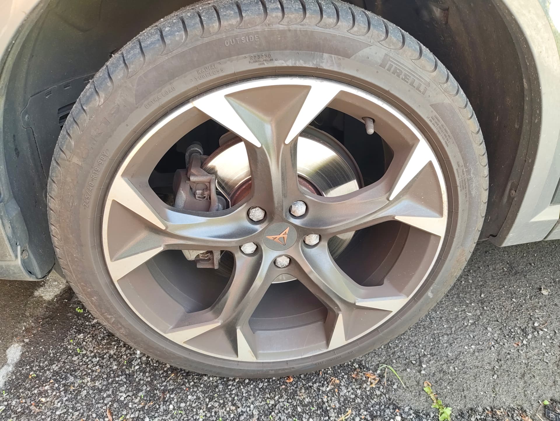 Cupra rear alloy wheel with heavy brake dust before decontamination