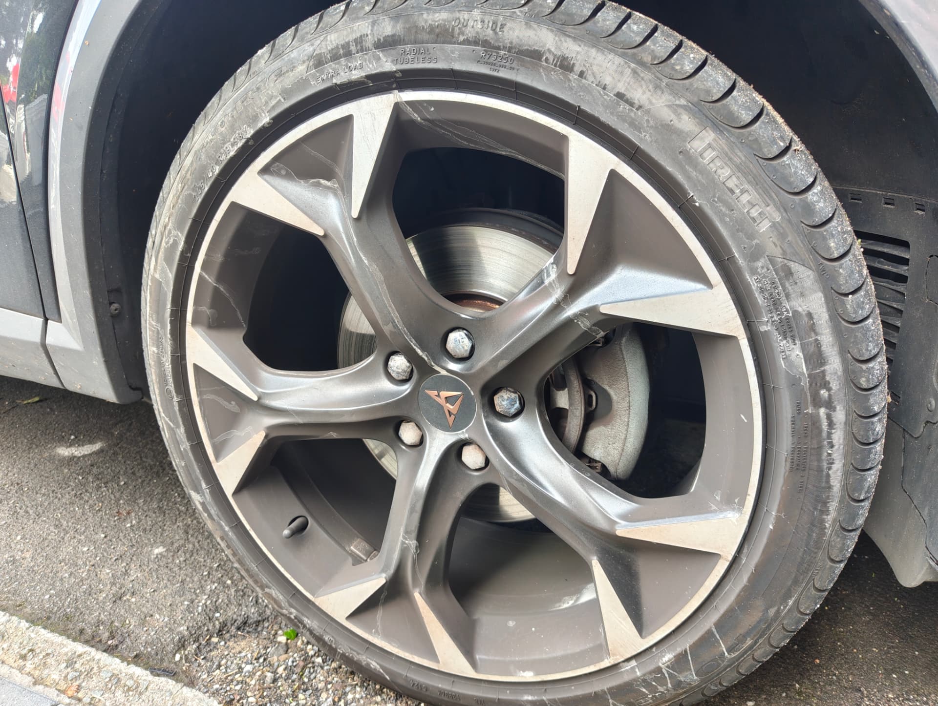 Cupra alloy wheel covered in brake dust before cleaning