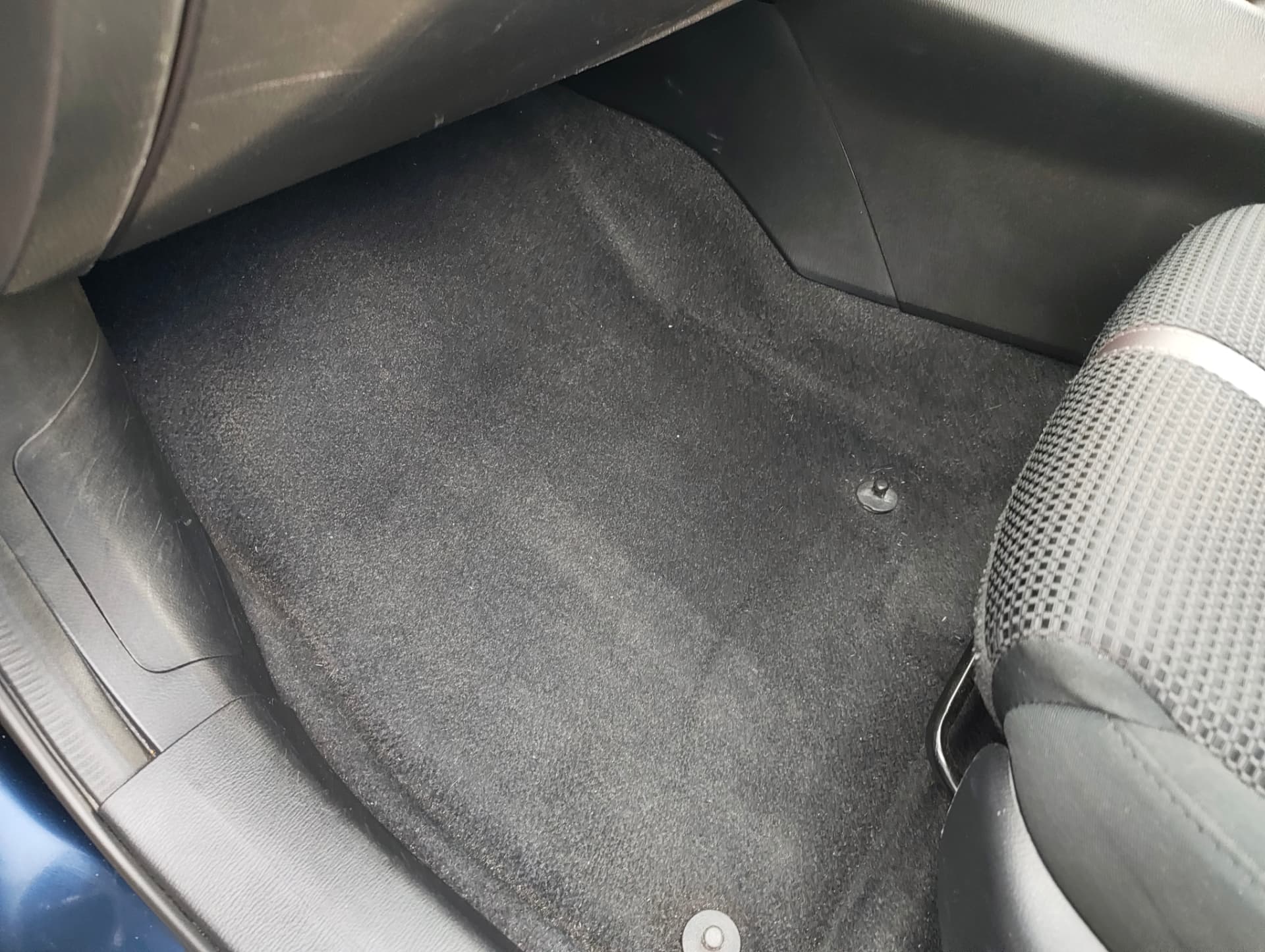 The same rear footwell carpet clean after extraction