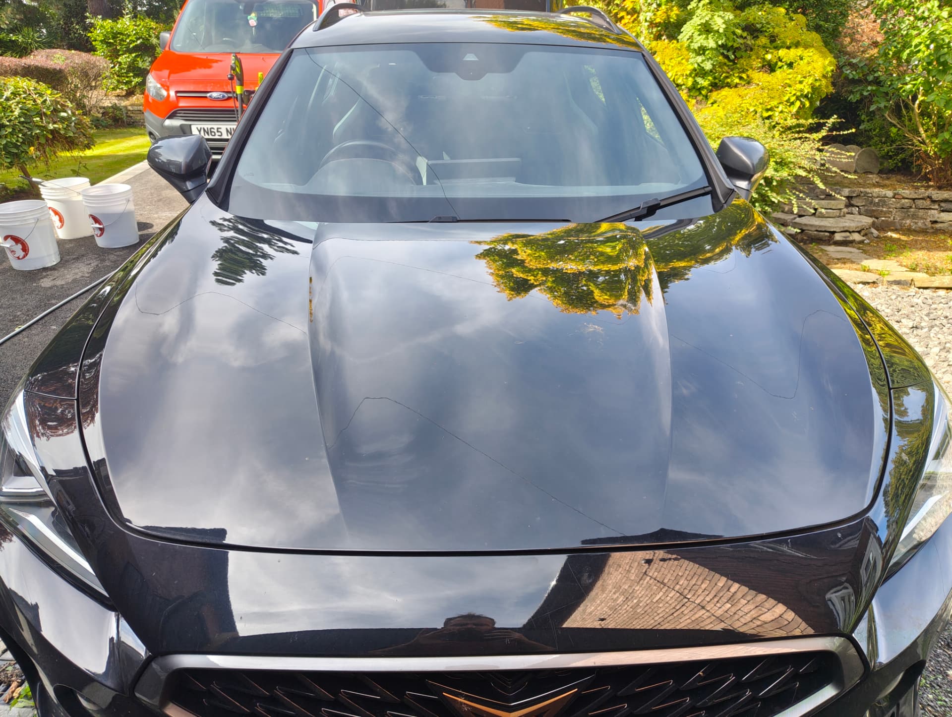 Cupra bonnet with dirt and water spots before paint correction