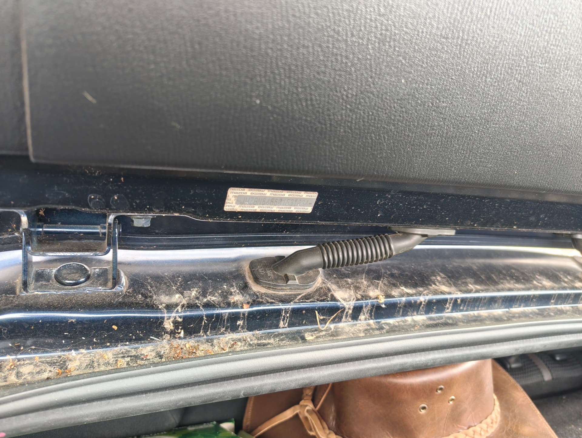 Boot sill with built-up grime before cleaning