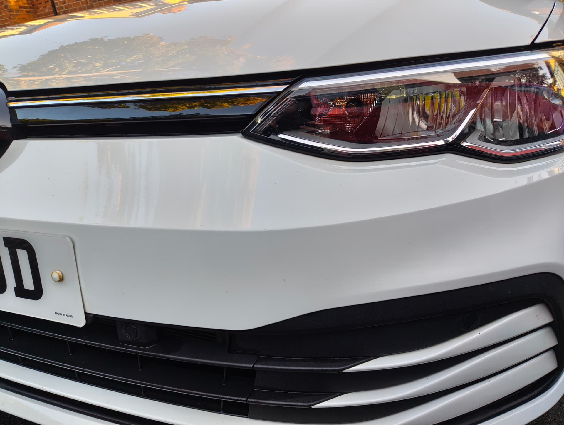 Golf front bumper and headlight clean after correction